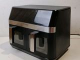 an image of a black and silver counter top toaster