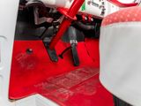 a close up view of a red and white vehicle ' s interior