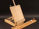 an artist ' s easel with a piece of wood on it