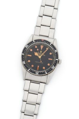 an image of a close up of a wrist watch on a white surface