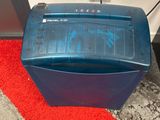 a blue paper shredder sitting on top of a red carpet