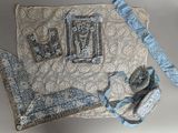 a picture of a piece of cloth with a blue bow