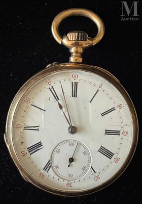 a gold pocket watch with roman numerals on it