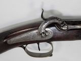 an old gun that is on display in a museum
