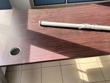 a baseball bat sitting on top of a wooden table