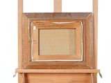 an old wooden easel with a painting on top of it on a white background