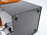 a black box with a brown handle on top of it