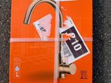 an orange book with a picture of a faucet on it