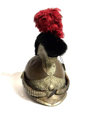 a stuffed animal sitting on top of a helmet