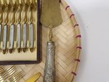 a tray with silverware and a knife and fork on it