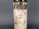 a bottle of wine that is sitting on a table