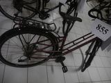 a red bicycle that is on display in a store