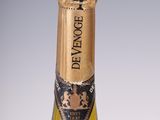 an old bottle of champagne sitting on top of a table