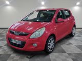 a picture of a red car parked in a garage