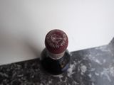 a bottle of wine that is sitting on a counter