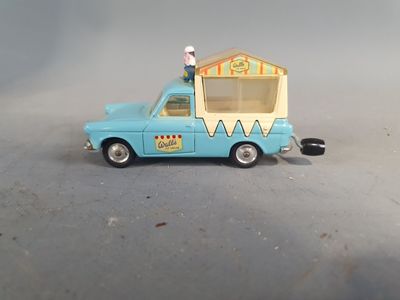 a toy car with a ice cream cone on top of it