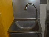 a stainless steel sink with a faucet attached to it