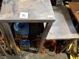 two tables that are sitting next to each other on the floor