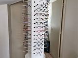 a rack with glasses on it in the corner of a room