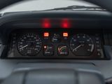 a close up of a car dashboard with a speedometer and gauges