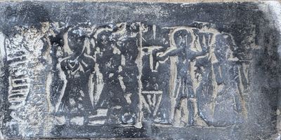 an image of a stone plaque with a group of people on it