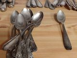 many spoons and spoon spoons on a wooden table