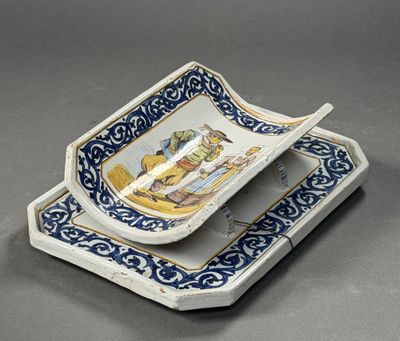 a blue and white plate with a spoon in it