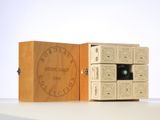 a wooden box that has a camera inside of it