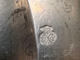 a close up of a metal object with writing on it