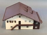 a small model of a house on a table