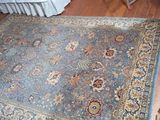a large blue rug on the floor in a room