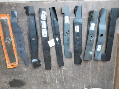 a lot of different types of blades on the floor