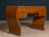 an image of a wooden desk with drawers and drawers