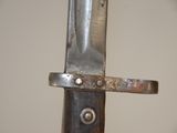 a close up of a knife with a metal handle