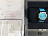 a watch that is in a box on the table
