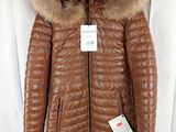 the jacket is brown and has a fur collar