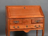 a small wooden desk with two drawers and a drawer underneath it