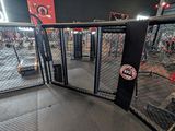 a view of a cage from the top of the stairs
