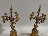 pair of antique brass candelabs with flowers and leaves