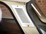 a close up of a car door with a small vent