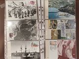 a binder with a lot of postcards on it