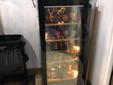 a small refrigerator with a lot of bottles in it