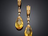 a pair of yellow sapphire and diamond earrings