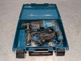 a blue tool box with tools in it on the floor