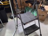 a ladder that is sitting in the middle of a room