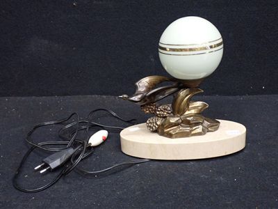 a lamp that is sitting on a wooden stand