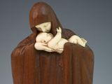 statue of a woman holding a baby in her arms