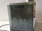 an image of a coffee grinder sitting on a counter