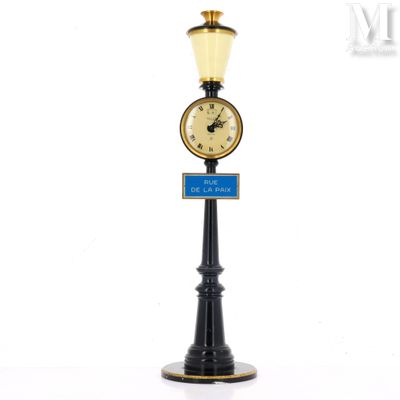a clock that is on top of a lamp post