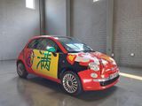 a small red car with chinese writing painted on it